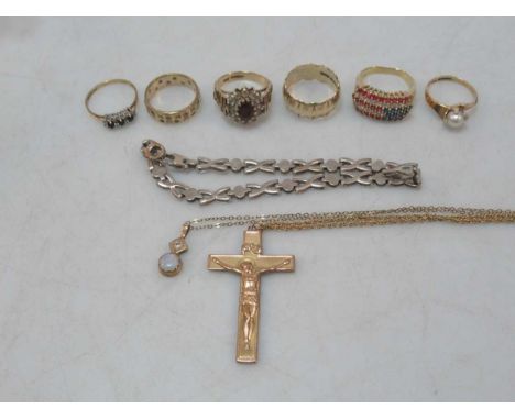 A ring stamped '10K', together with five hallmarked 9ct gold rings, a hallmarked 9ct gold cross and chain, a hallmarked 9ct g