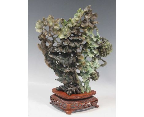 A carved jade ornament, 30cm high including stand