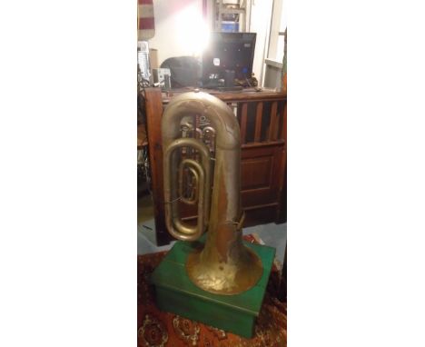TUBA LAMP, brass on a green painted platform base, 138cm H. (converted) (with faults)
