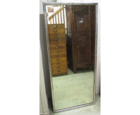 WALL MIRROR, 19th century French silvered wood with moulded rectangular frame and bevelled plate, 188cm x 84cm.