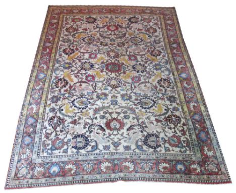 FINE TEHRAN CARPET, 285cm x 205cm, palmettes, animals and scrolling foliage on an ivory field within a repeat palmette terrac