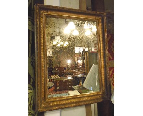 WALL MIRROR, late 19th century rectangular giltwood and gesso with leaf and berry decoration, 68cm W x 88cm H. (with faults a