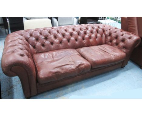 CHESTERFIELD STYLE SOFA, with buttoned brown leather upholstery on bun feet, 220cm L x 73cm H x 97cm D. (with faults)