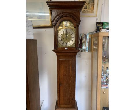 A quality long case Grandfather clock, 11-inch square brass dial with silvered centre, date aperture and engraved fruit baske