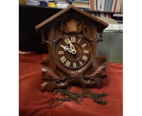 A Camere Cuss &amp; Co Cuckoo Clock, with weights, in need of some restoration. Buyer collects