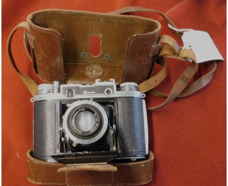 The Ensign Commando Camera was made in 1945 - A dual format camera taking either 12 or 16 exposures on A120 film, the range f