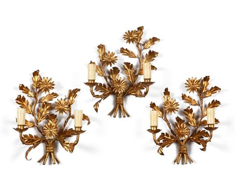 A TRIO OF GILT METAL TWIN BRANCH FLORAL MOTIF WALL LIGHTS 20TH CENTURY each approximately 38cm high, 30cm wide, 13cm protuber