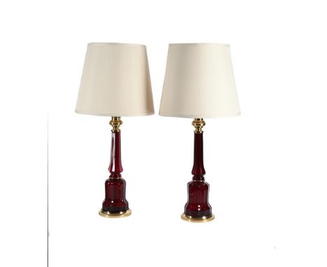 A PAIR OF LARGE CRANBERRY BOHEMIAN GLASS TABLE LAMPS 20TH CENTURY  together with cream shades  each approximately 55cm high, 