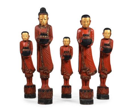 A SET OF FIVE GRADUATED CARVED AND POLYCHROME PAINTED FIGURES OF BUDDHIST MONKS  MID 20TH CENTURY  The largest 126cm high, th