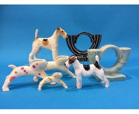 Two Beswick candlesticks, 423, a Beswick Dog, 'Talanera Romulus', a Doulton dog, HN1014 and three Poole leaping Horses