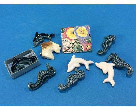 A collection of Poole pottery brooches