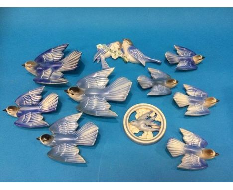 A collection of nine Poole 'Swallow' wall plaques and a circular plaque (10)