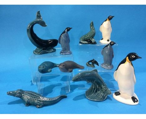 Four Poole pottery penguins, a whale, three seals, leaping salmon, a miniature dolphin and an alligator (11)