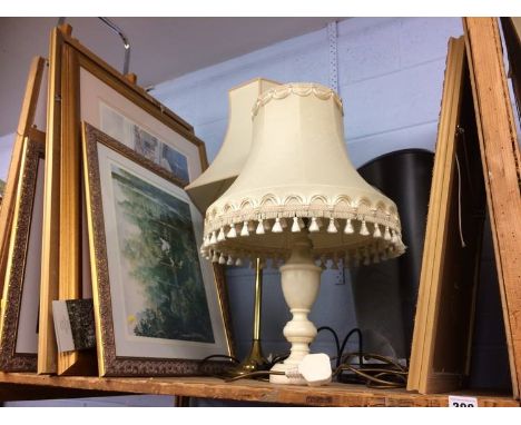 Various prints and a lamp