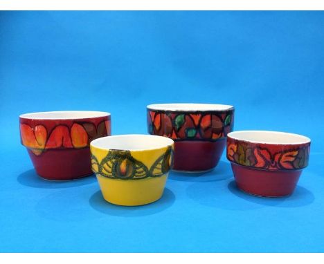 Four various Poole pottery pots