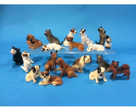 A collection of seventeen Royal Doulton miniature dogs K 1,2,3,4,6,7,8,9,10,11,12,13,14,15,17,18,19, a Doulton penguin, H21 a