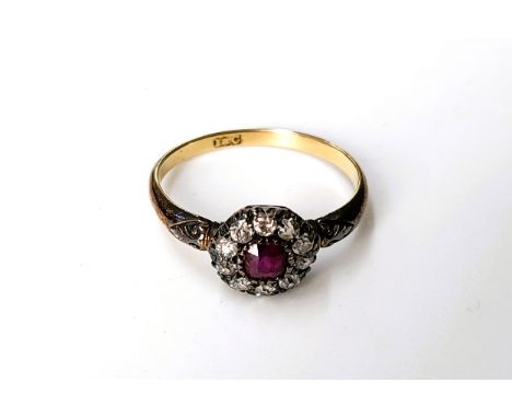 A rose gold diamond spinel ruby centre ring