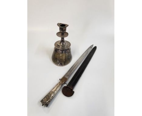 A silver plate candlestick inscribed 'Greybie aged 27' on a shod horse hoof, has imperfections to the candlesticks rim, 18cm 