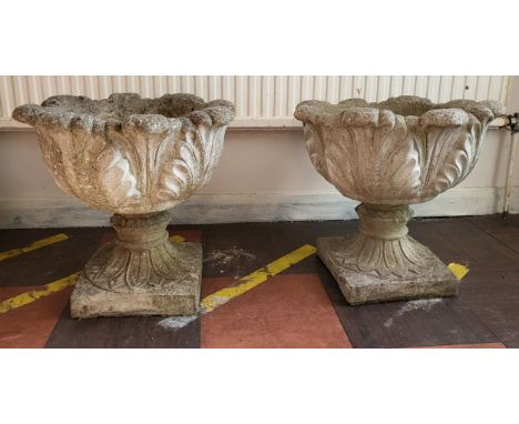 A pair of garden urns on square bases. 47cm high, 48cm diameter. (2)
