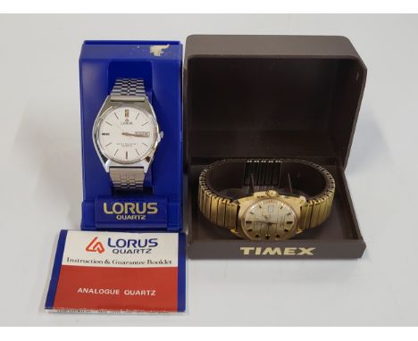 A Lorus water resistant quartz day/date on a stainless steel articulated bracelet. Also including a vintage Timex, water resi