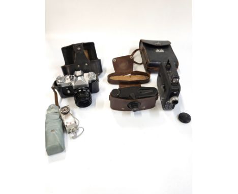 Three cameras including a Zenit 8 35mm SLR with case, Beck Anastigmat with case, and a Cine Kodak-Eight Model 20,  and Nation