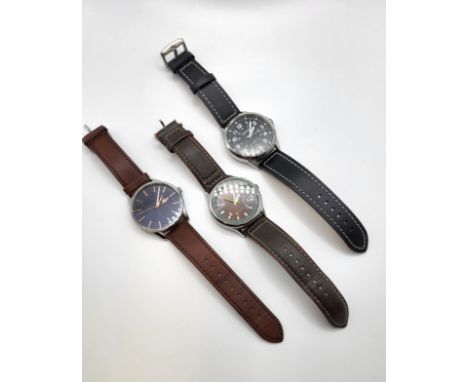 Three gentlemen's watches, a quartz Lacoste, a Lorus Diver's watch (Resist 100 meters) and a Sekonda Date Just Diver's watch 