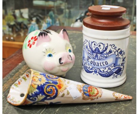 A Dendan ware ceramic pig money box; together with a French faience wall pocket, Le Warve and a tobacco jar 