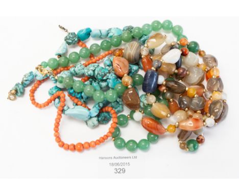 Four semi precious gemstone necklaces, comprising a turquoise nugget bracelet and necklace set, a coral necklace, a multi sto