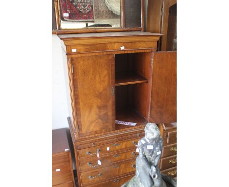 ***AMENDED DESCRIPTION***A George III style mahogany drinks cabinet with two doors opening to reveal single shelf, the base s