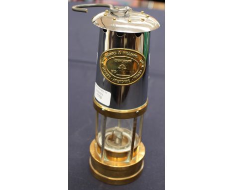 A late 19th/early 20th Century miners lamp, stamped E. Thomas and Williams Ltd 