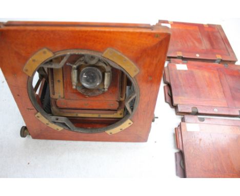 A vintage plate camera, circa 1900 and plates x 3, with 'Bausch and Comb' lens 