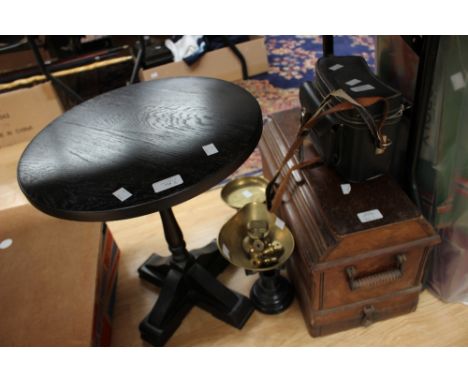 A Rollsmat cine camera in case, a set of shop scales, a manual Singer sewing machine in case and a small table 