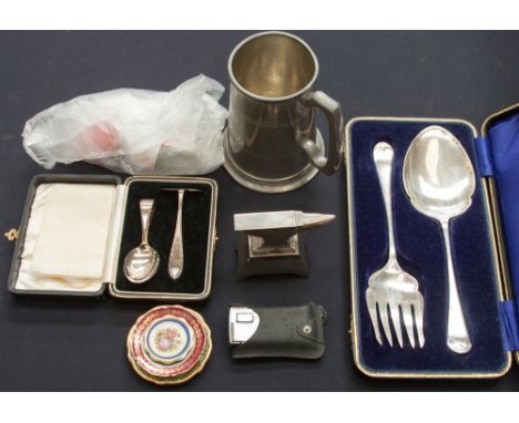 A boxed set of 'pusher and spoon' Birmingham 1936, a boxed serving spoon and fork (EPNS) a white metal Anvil paperweight, pew