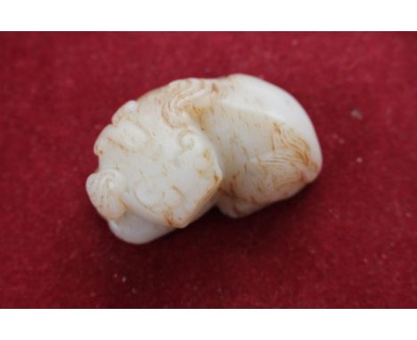 A white jade Chinese lion, Qing period 