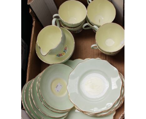 A Foley china tea service, green/yellow body with floral rims 