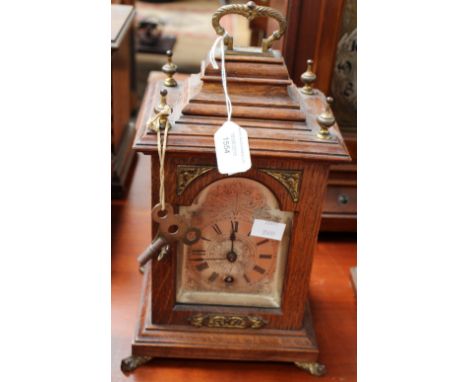 An early 20th century oak cased bracket clock, gilt metal mount, movement stamped Lenzkirch