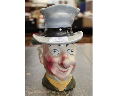A ceramic tobacco jar, Ally Sloper top hat forms lid to pot 