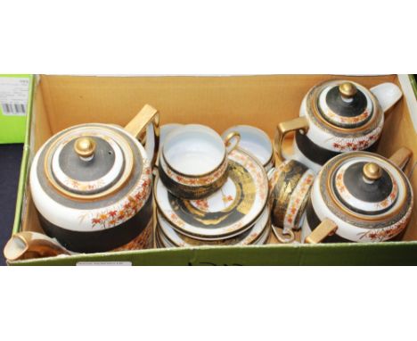 An early 20th century Japanese eggshell coffee set, comprising coffee pot, cream jug, sugar bowl, five cups and six saucers