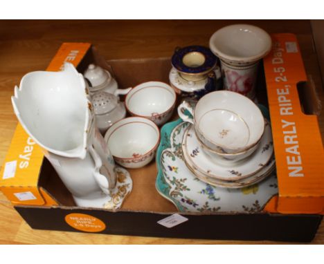 A collection of early 19th Century ceramics, including a pair of tea bowls, tea cups and saucers, a cylindrical vase depictin