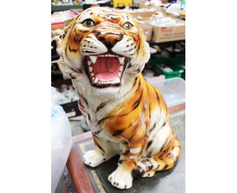 A large ceramic Tiger, twenty four inches tall approx 