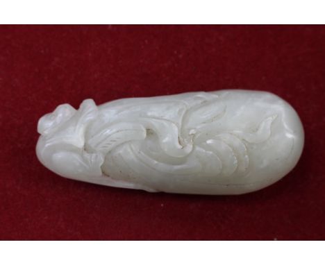 A Chinese jade carving of a monkey on a peach