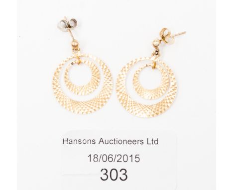 A pair of 18ct gold earrings of hoop design, with engine turned decoration, 3.9 grams approx 