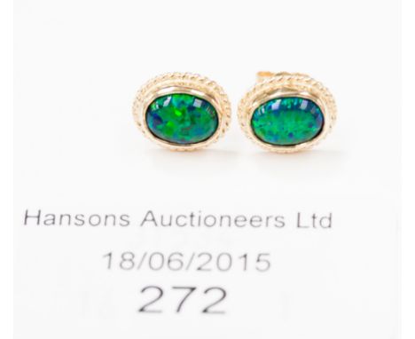 A pair of 'synthetic' imitation black opal 9ct gold studs