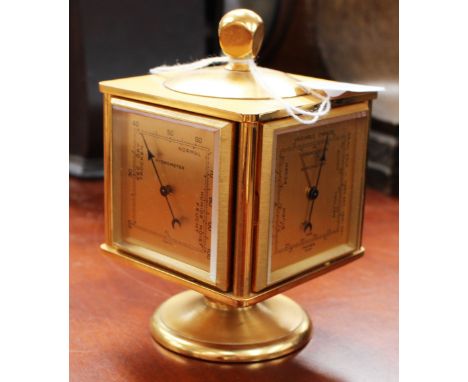 An Imhof four sided desk clock, hygrometer, barometer and thermometer, of cube form with square dials, Swiss movement, on a c