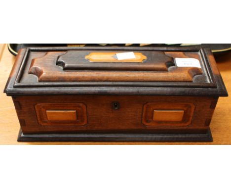 A late Victorian oak casket style box, the interior of the lid bears a glazed handwritten piece of paper inscribed 'The Oak o