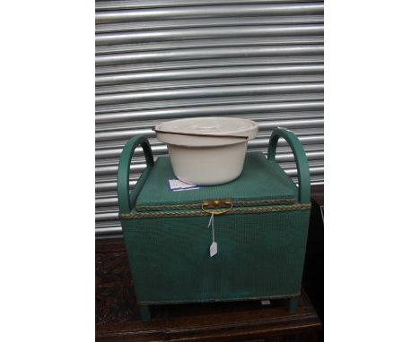 A green painted wicker commode, together with a white ceramic lidded pot.(2)