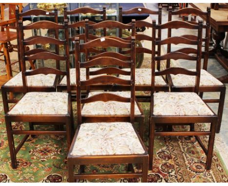 A set of eight Ercol ladder back dining chairs ****TO BE SOLD WITHOUT SEAT CUSHIONS****