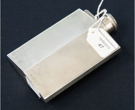 A George V silver hip flask of lozenge outline, engine turned decoration, bayonet fitting to hinged cover, maker HCD, Birming