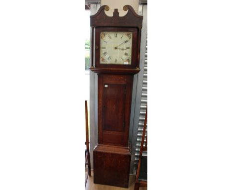 An early 19th century oak cased long cased clock, painted 11 inch dial with Roman numerals, shell inlay, trunk door