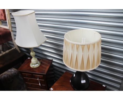 An Onyx table lamp; together with a further black table lamp (2) 